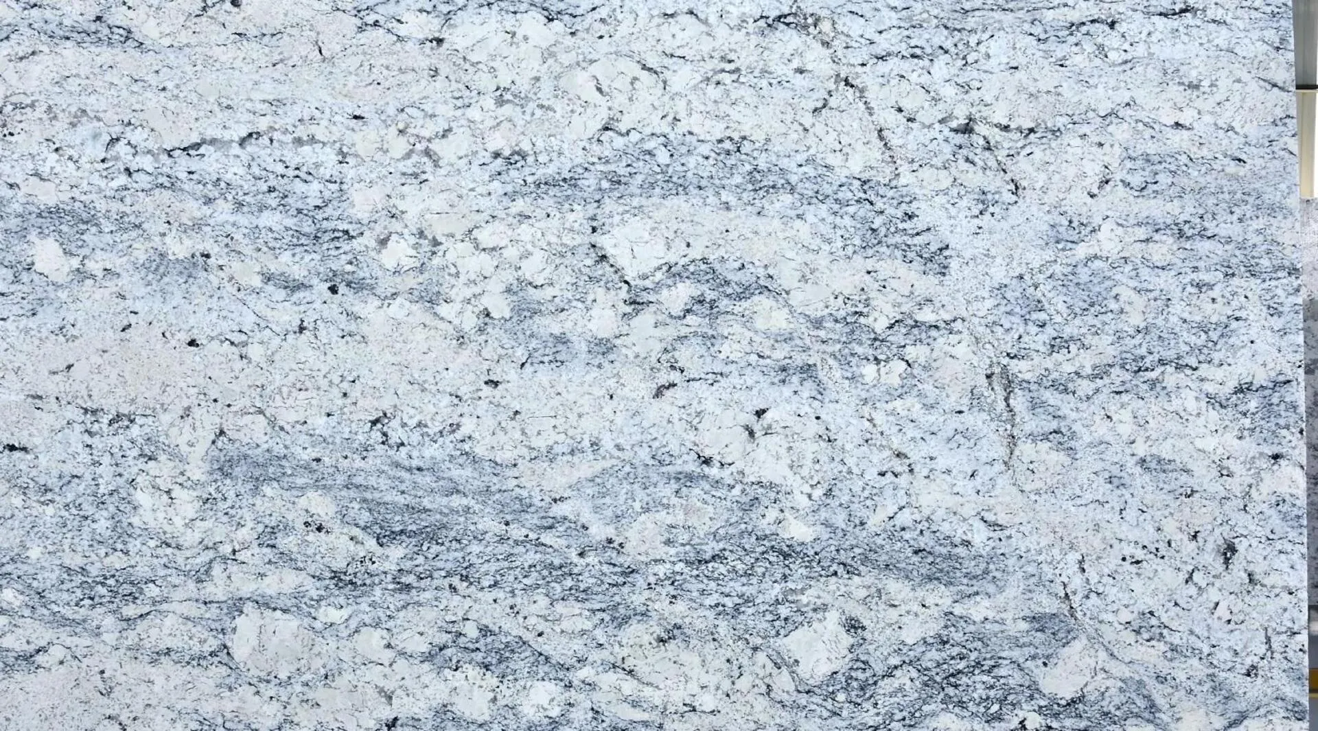 Closeup image of White Ice 1st Choice White Granite countertop slab