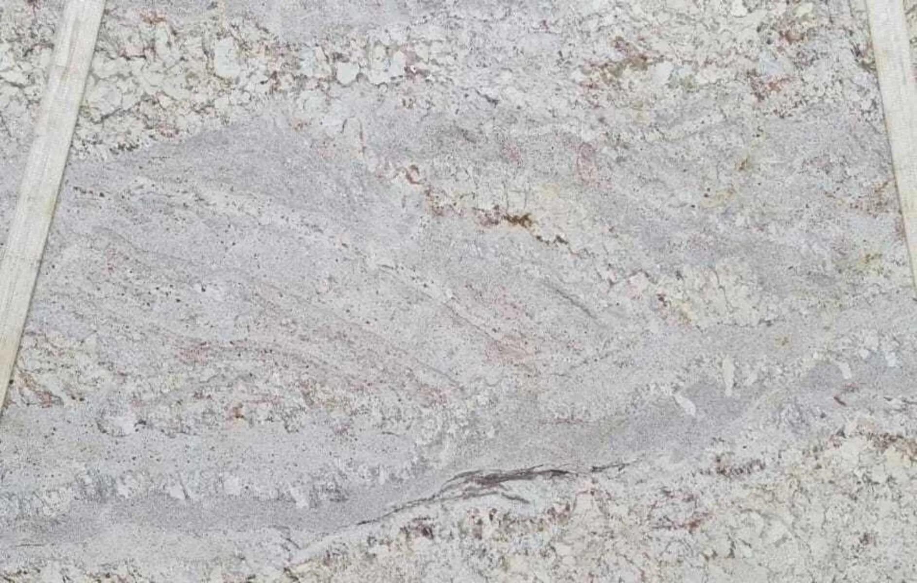 Closeup image of White Spring 1st Choice Cream Granite countertop slab