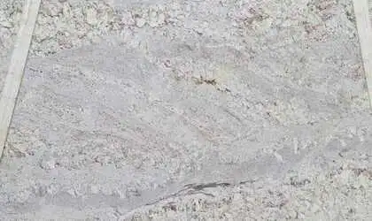 Closeup image of White Spring 1st Choice Cream Granite countertop slab