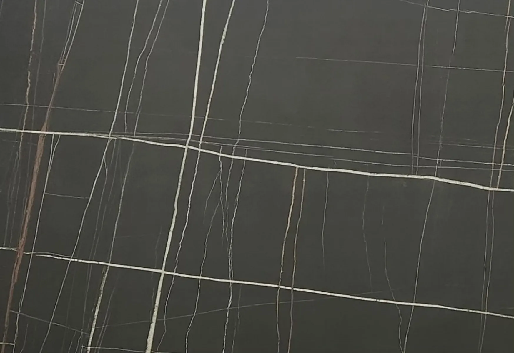 Closeup image of Opal Surfaces Sahara Elegant Black Porcelain countertop slab