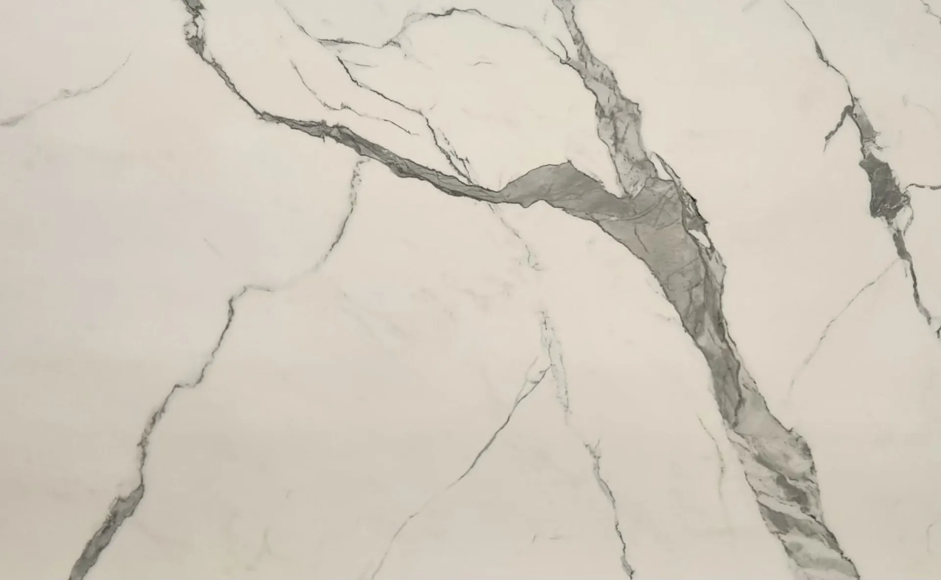 Closeup image of Opal Surfaces White Statuario White Porcelain countertop slab