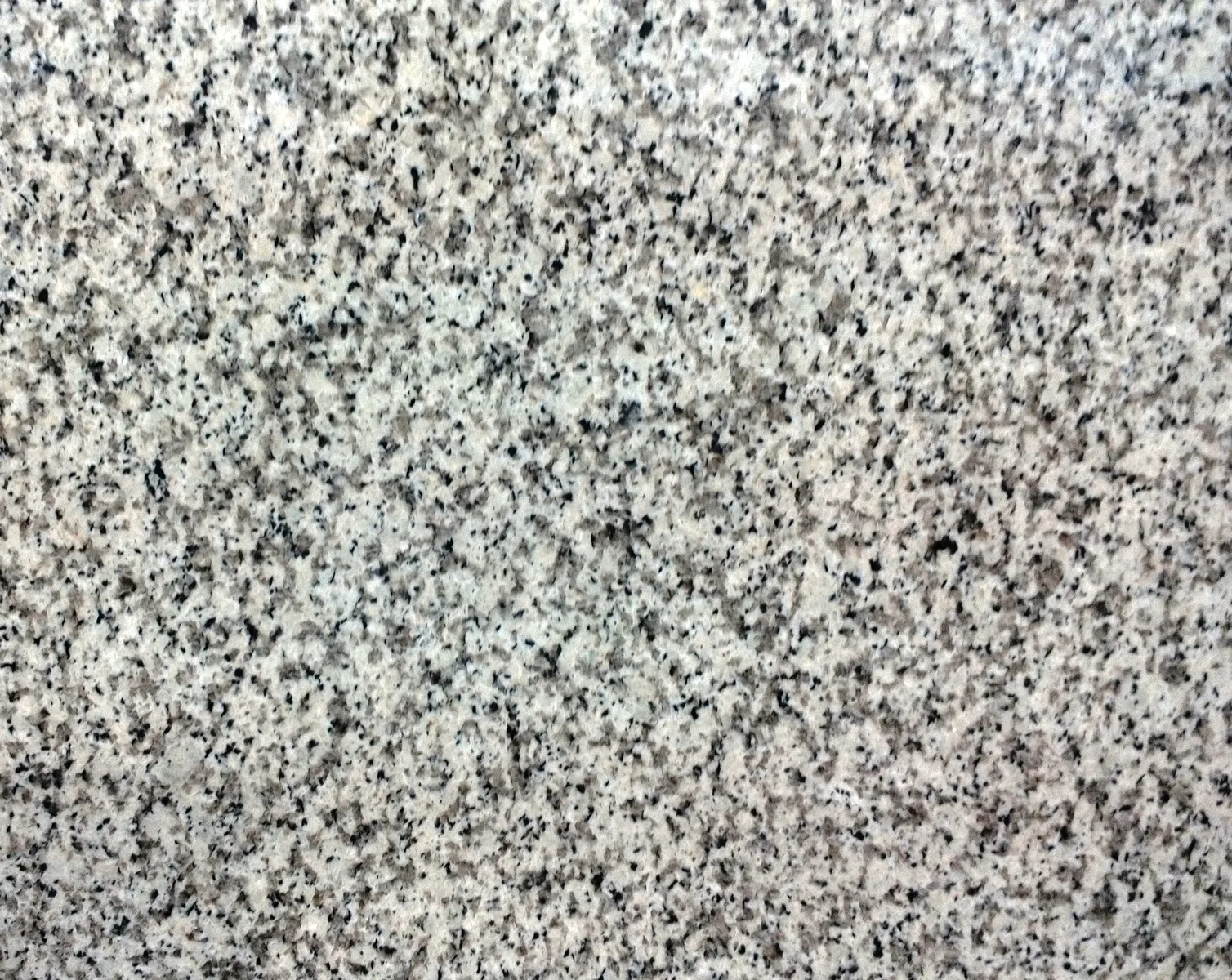 Closeup image of Blanco Real (Atlantico) Cream Granite countertop slab