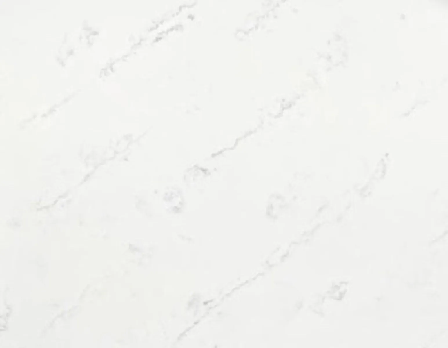 Closeup image of Opal Quartz Carrara Tadpole White Quartz countertop slab