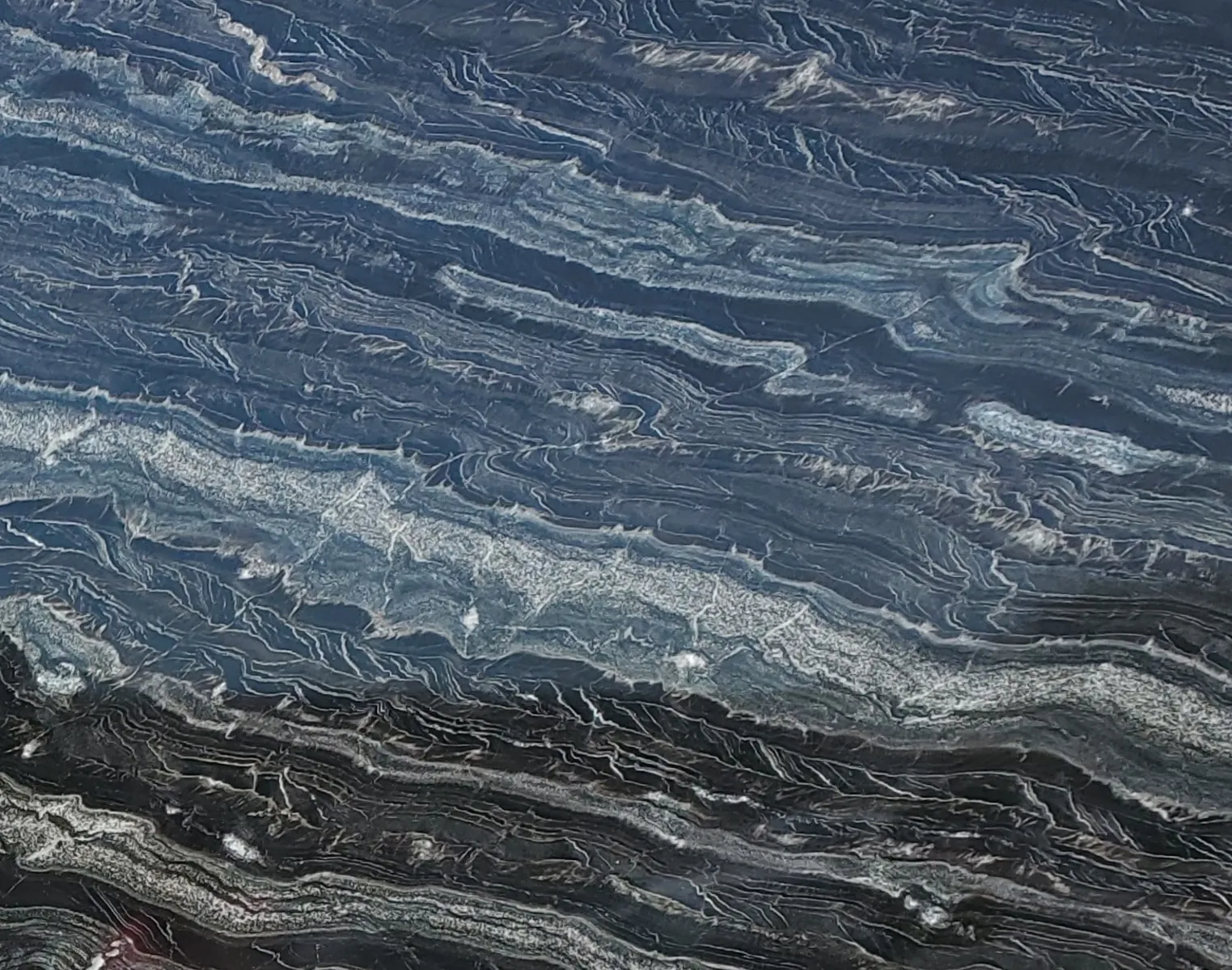 Closeup image of Agatha Black Blue Granite countertop slab