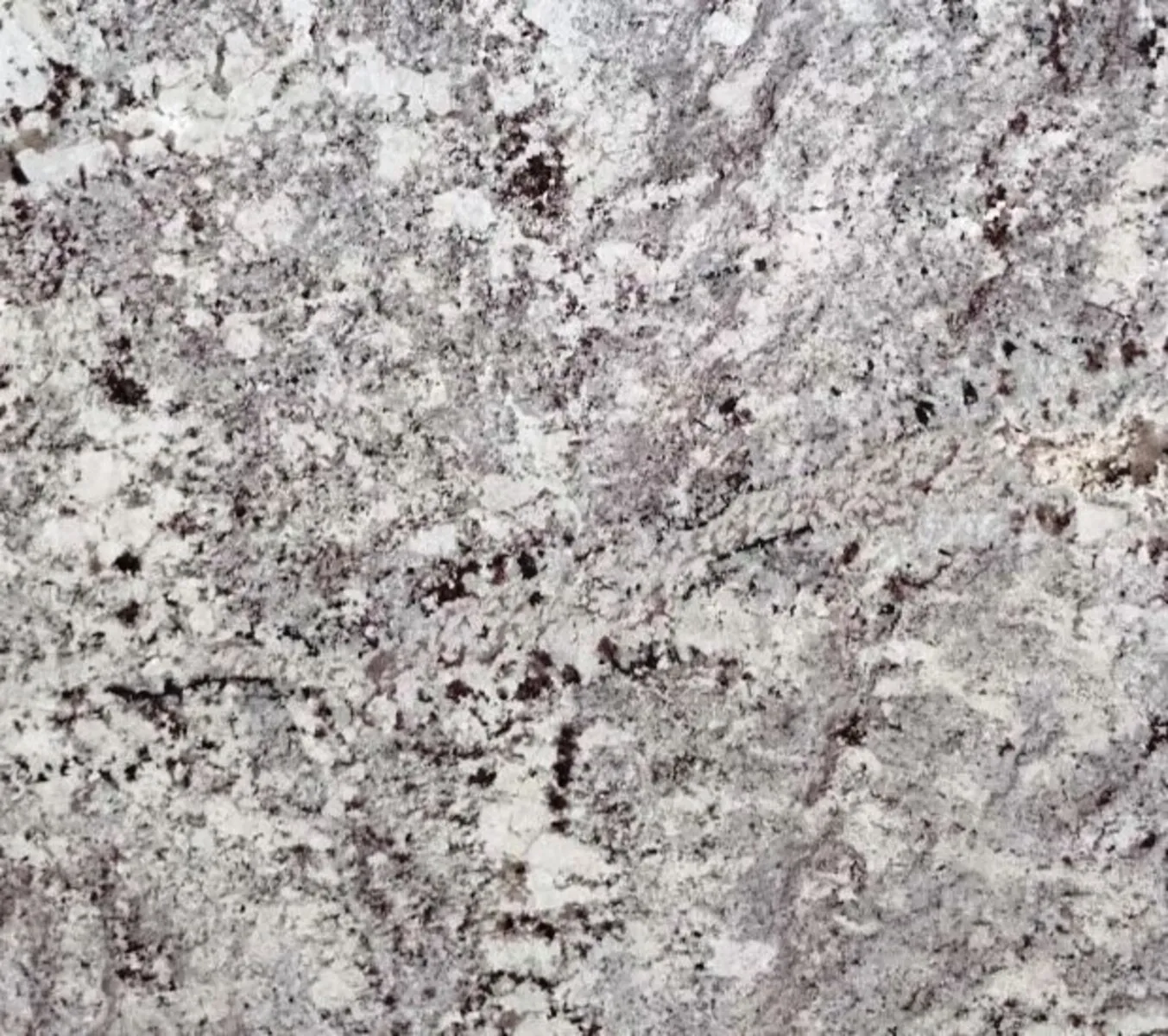 Closeup image of Alaskan White Cream Granite countertop slab