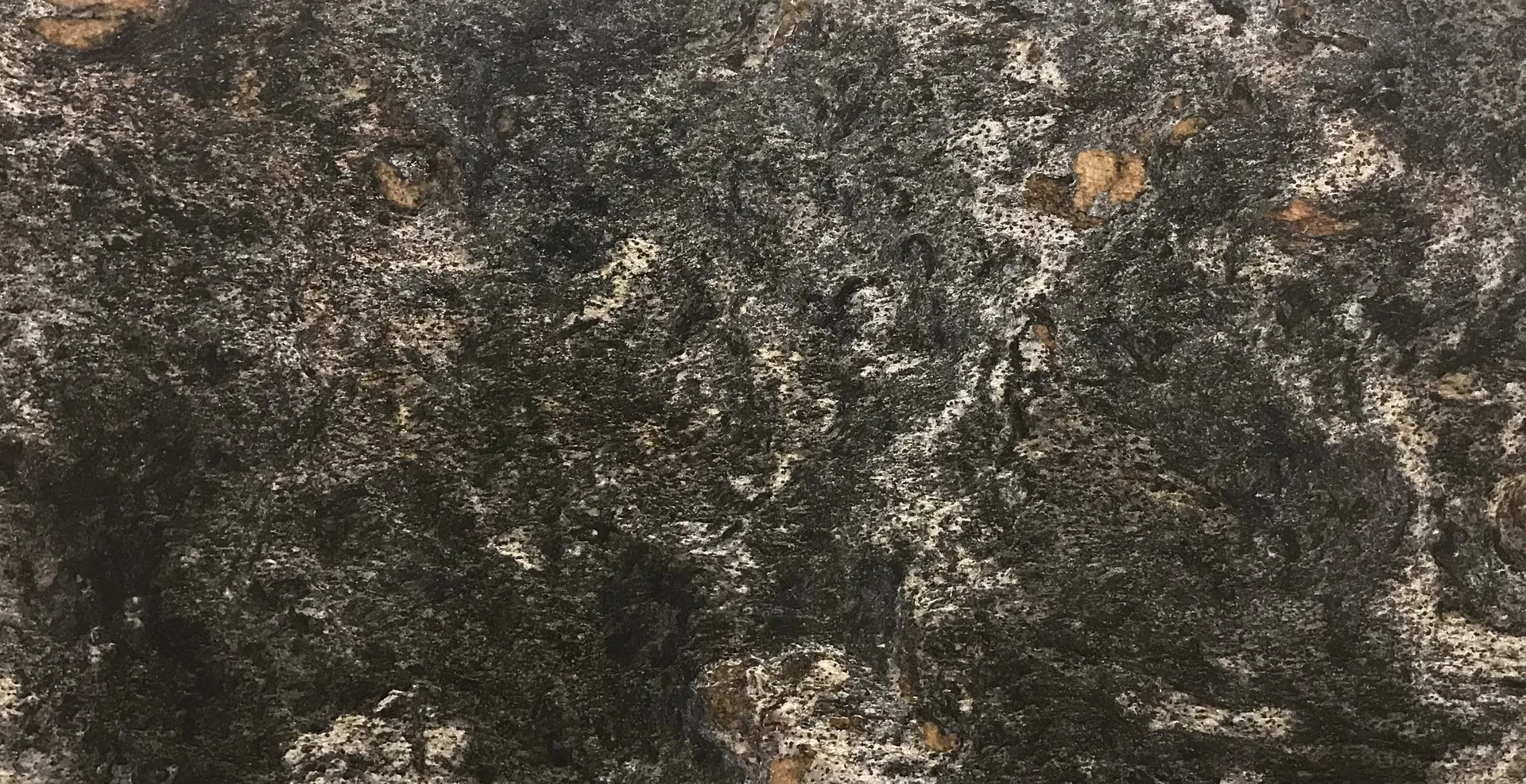 Closeup image of Asterix Velvet Black Granite countertop slab