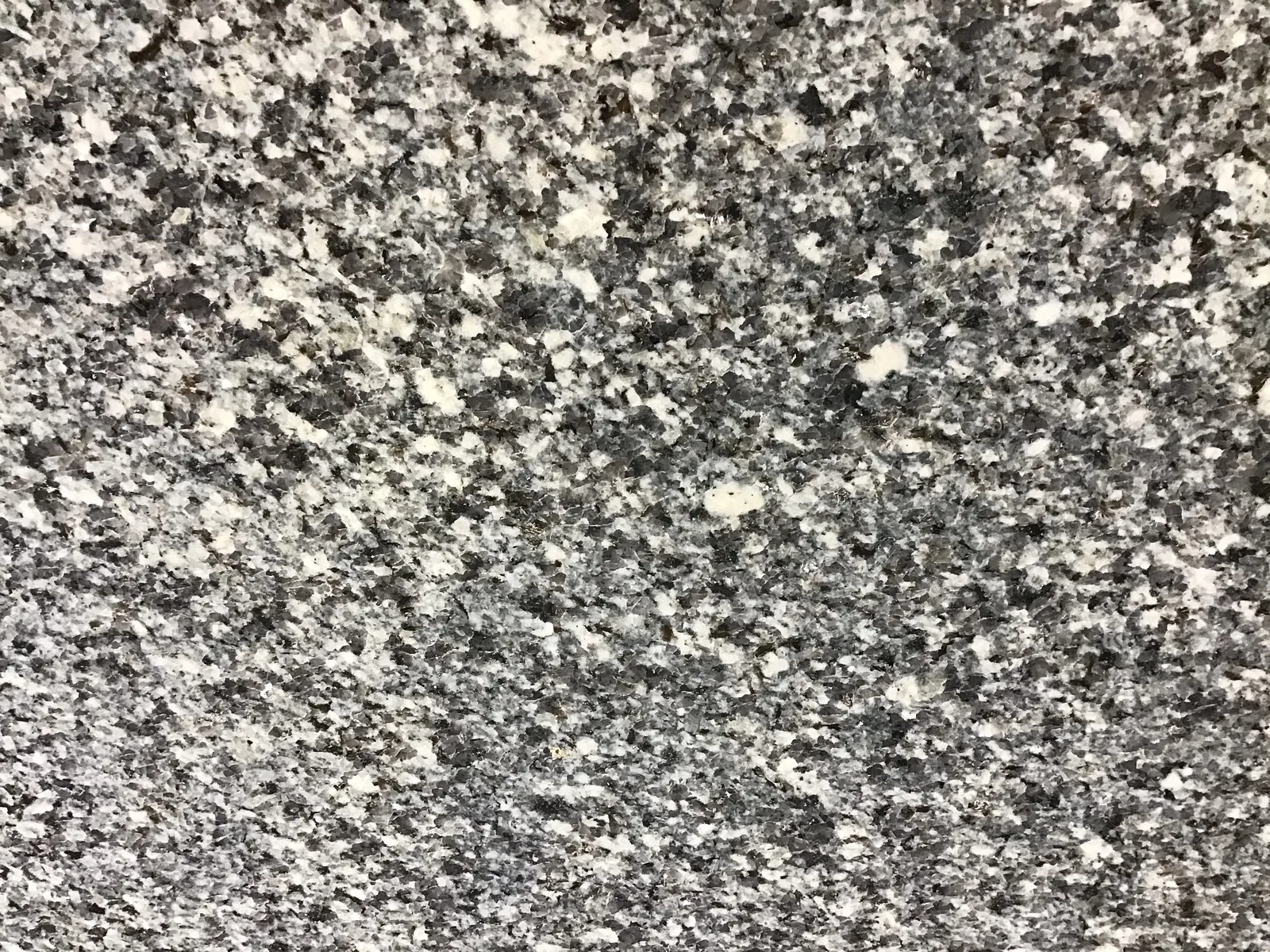 Closeup image of Azul Platino Primera Grey Granite countertop slab
