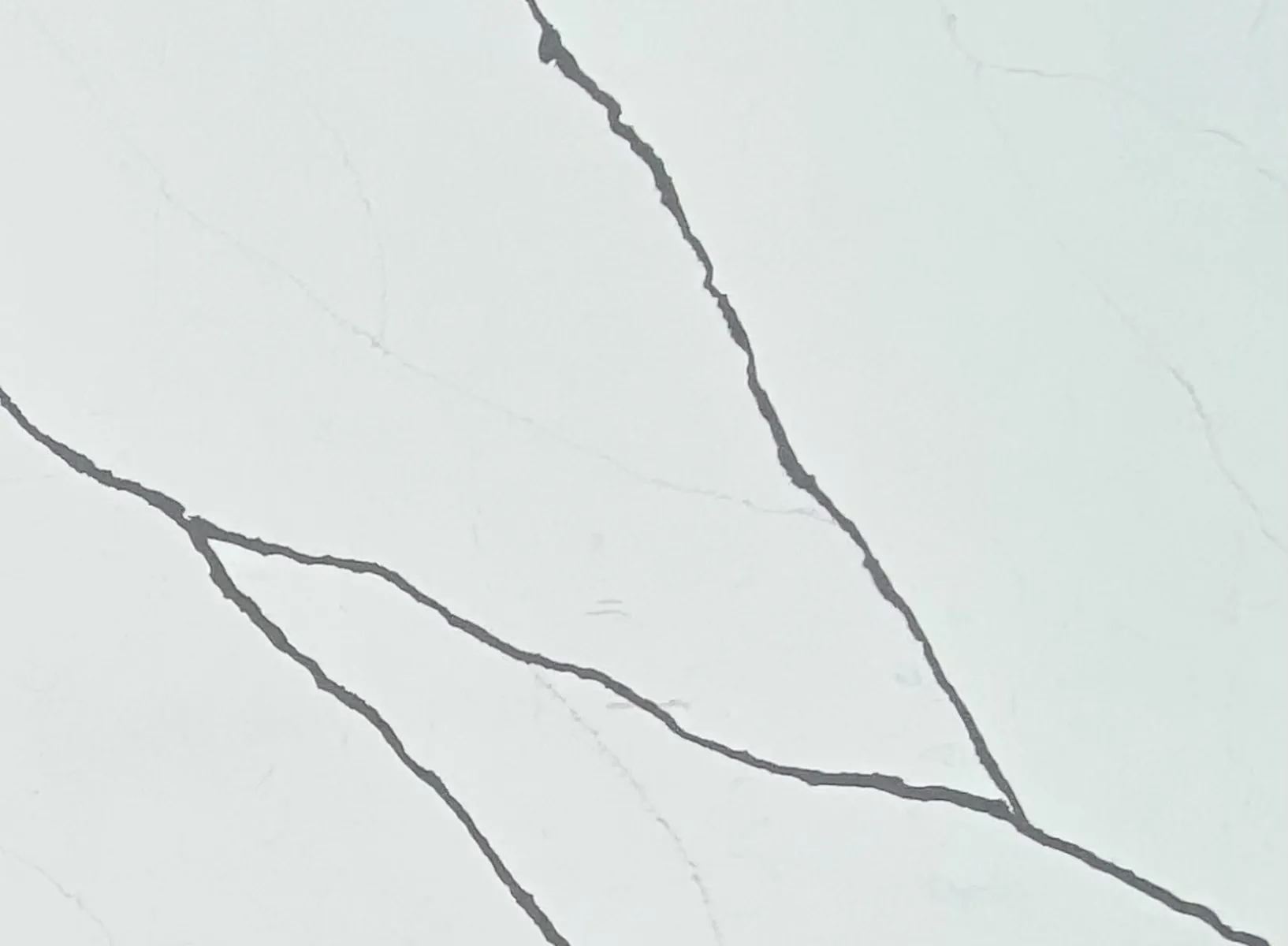 Closeup image of Opal Quartz Bianco Marquina White Quartz countertop slab