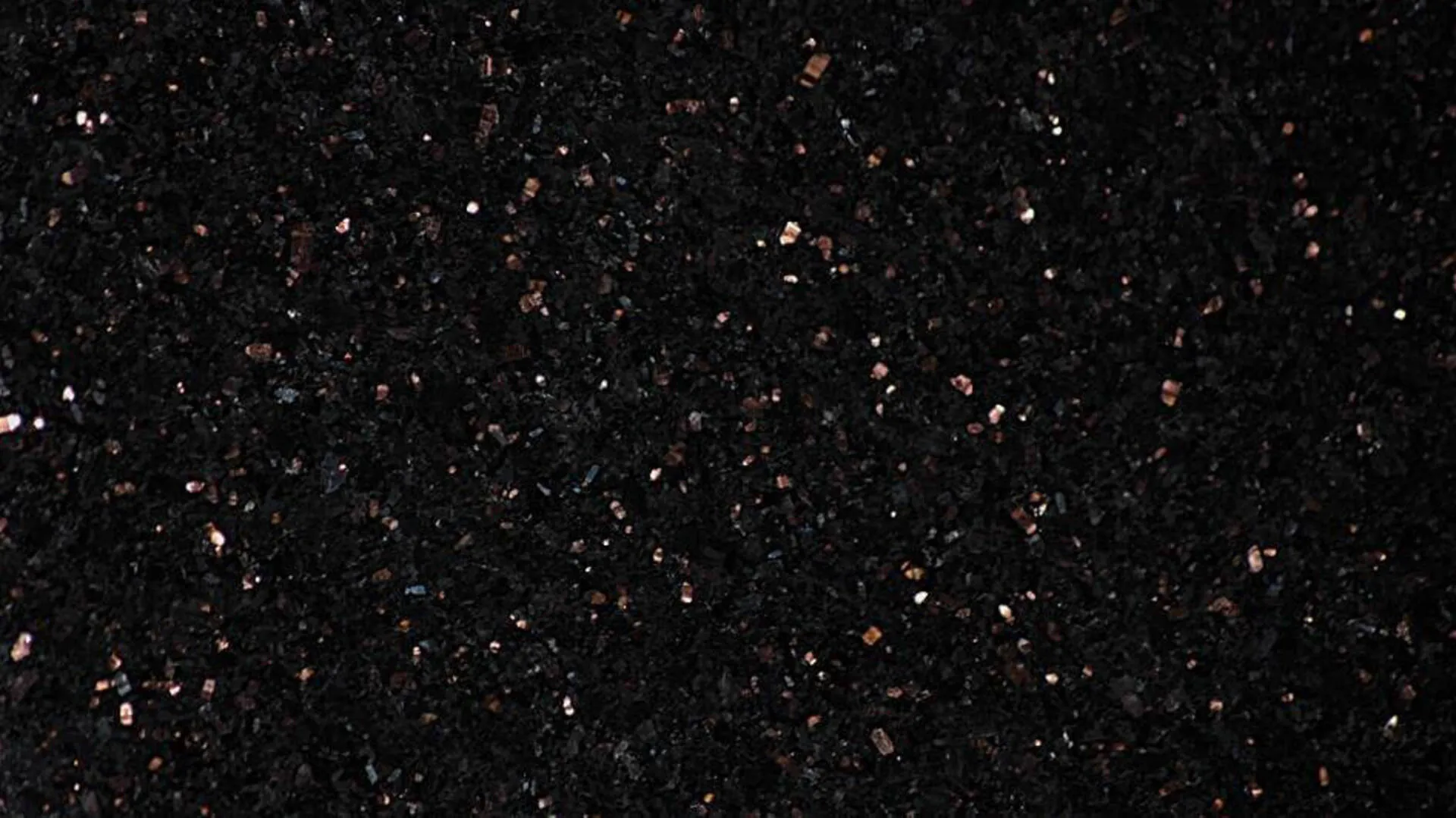 Closeup image of Black Galaxy Black Granite countertop slab