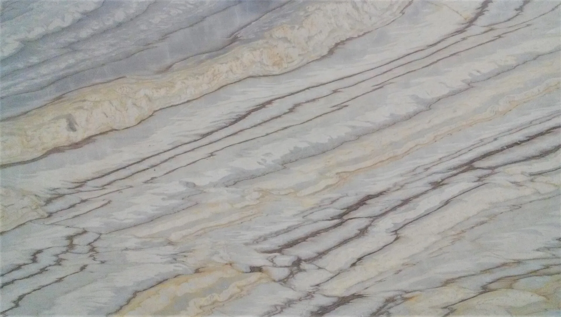 Closeup image of Calacatta Cielo Cream Marble countertop slab