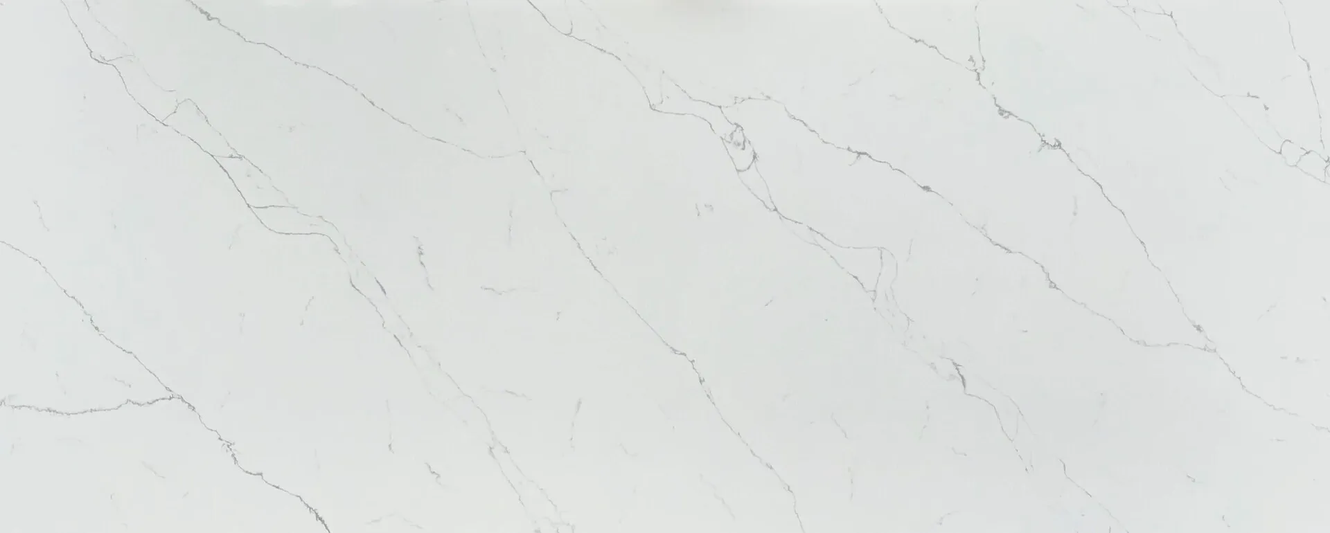 Closeup image of Opal Quartz Calacatta Rainfall White Quartz countertop slab