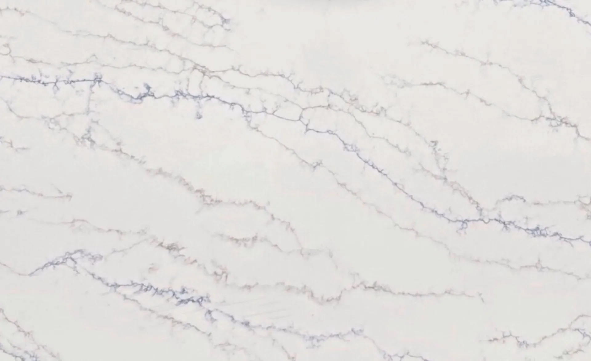 Closeup image of Opal Quartz Calacatta Ribbon White Quartz countertop slab