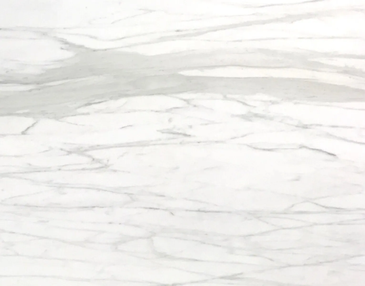 Closeup image of Calacatta Supreme White Marble countertop slab