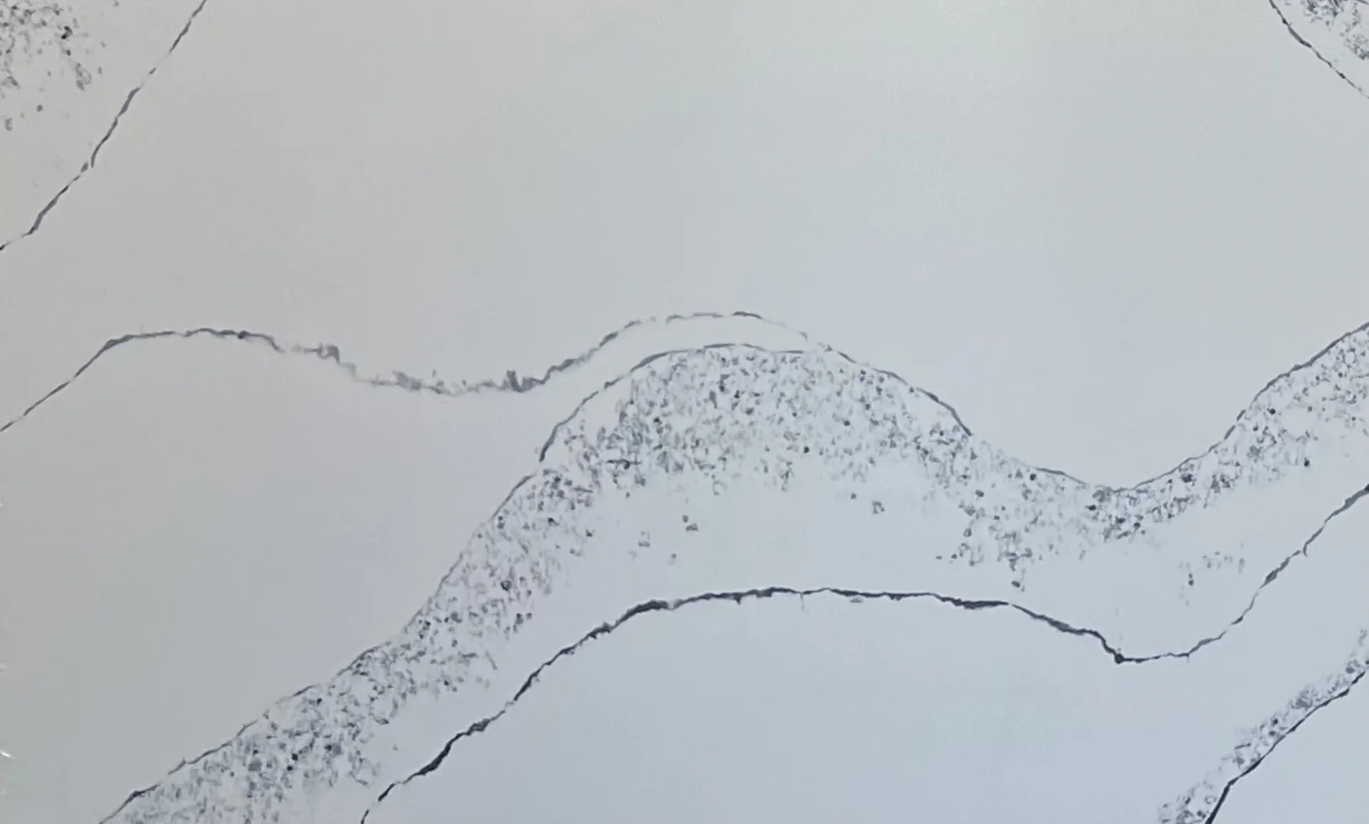 Closeup image of Opal Quartz Calacatta Wave White Quartz countertop slab