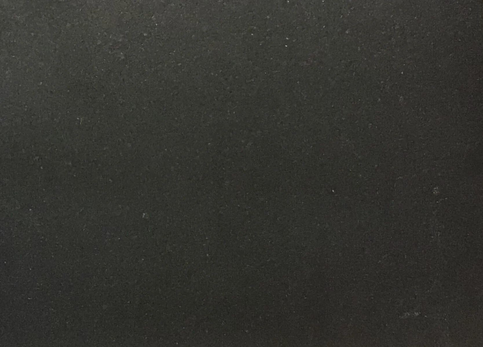 Closeup image of Cambrian Black Antique Black Granite countertop slab