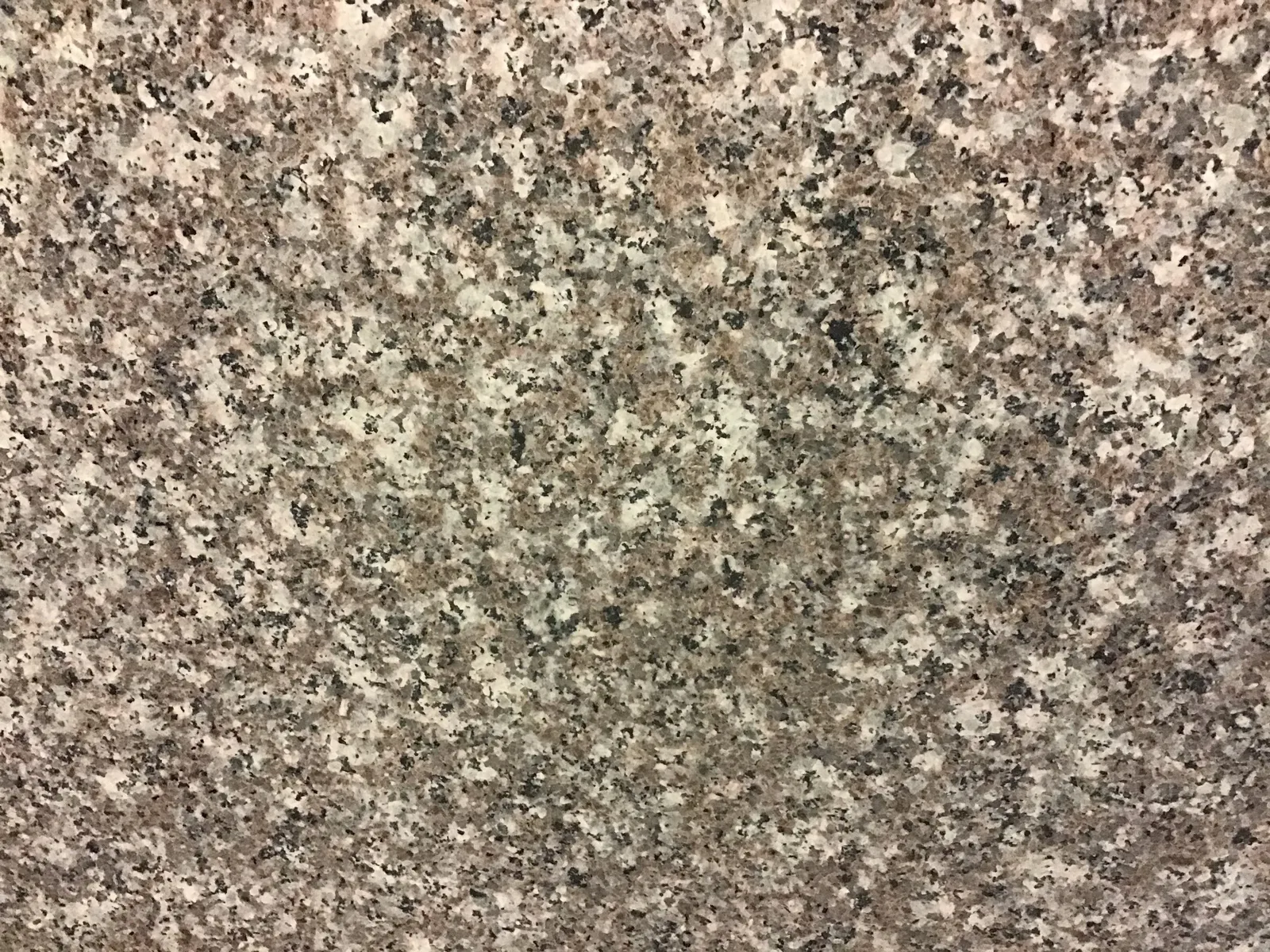 Closeup image of Copper Peach Brown Granite countertop slab
