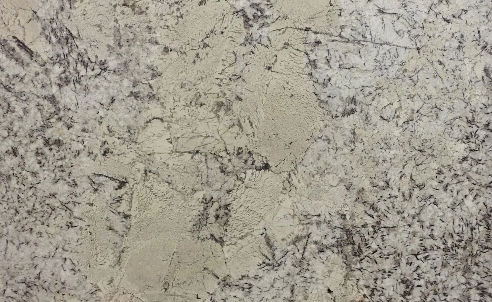Closeup image of Crema Antradita Beige Granite countertop slab