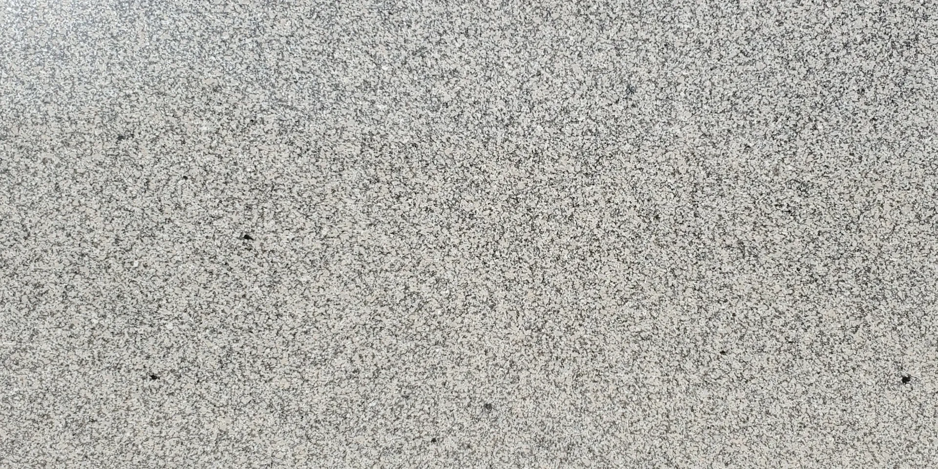 Closeup image of Crema Carmel Grey Granite countertop slab