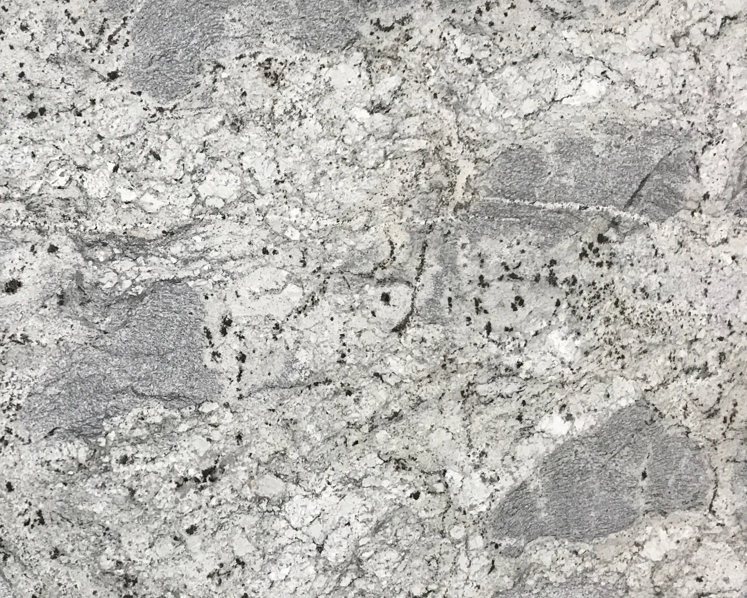 Closeup image of Crystal White Grey Granite countertop slab