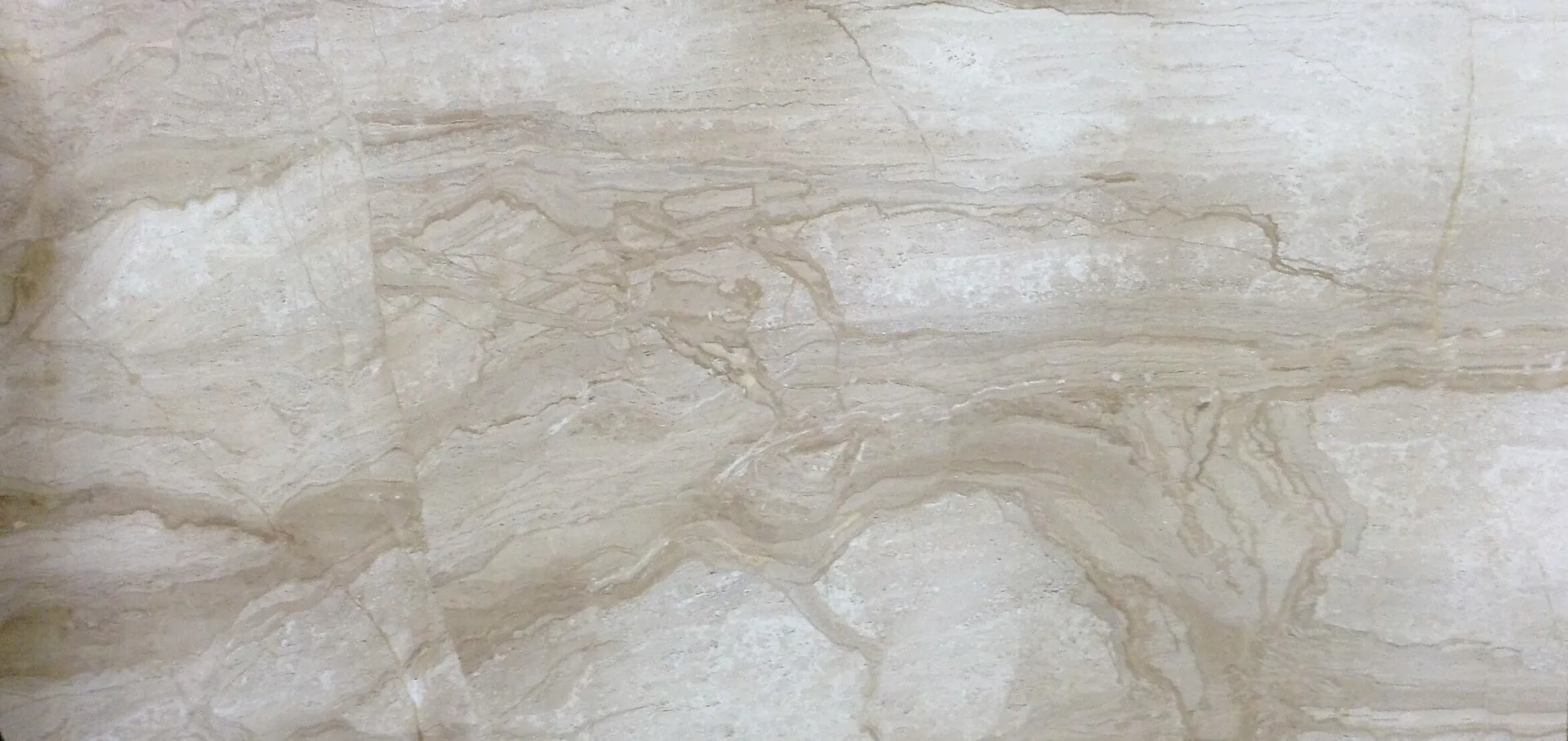 Closeup image of Daino Real Beige Marble countertop slab