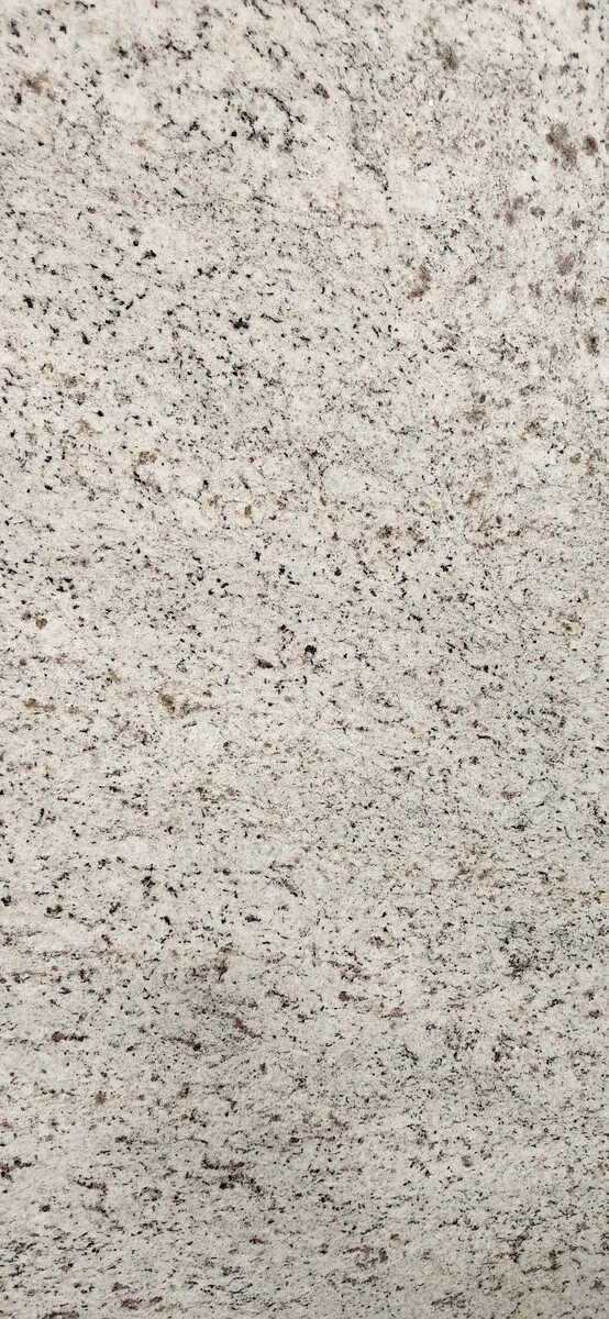 Closeup image of Everest Mist Cream Granite countertop slab