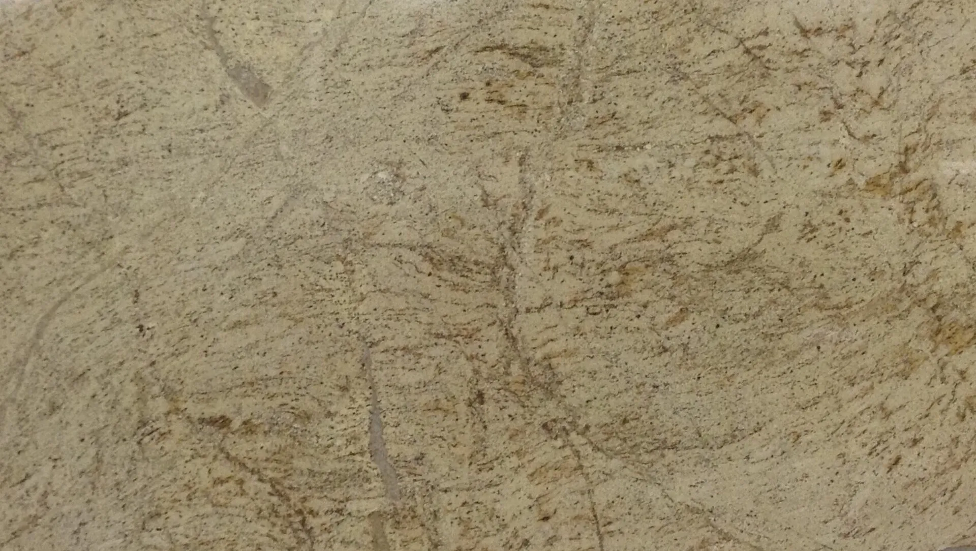 Closeup image of Juparana Cappuccino Beige Granite countertop slab