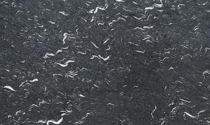 Closeup image of Laguna Black Finish Black Granite countertop slab