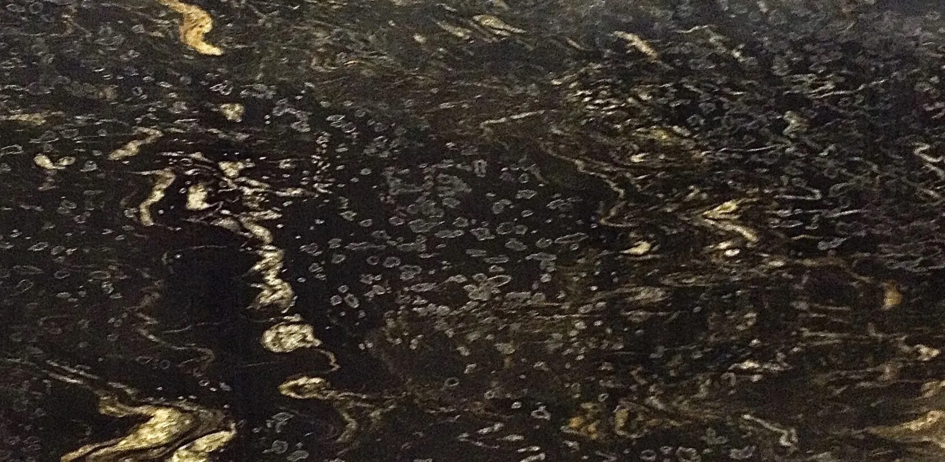 Closeup image of Matrix Motion Black Granite countertop slab