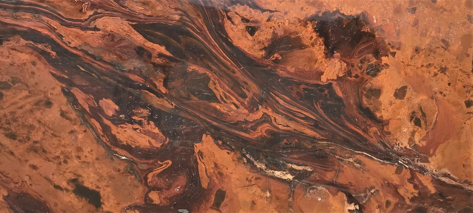 Closeup image of Mirage Brown Granite countertop slab
