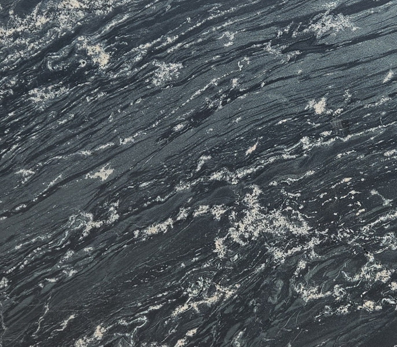 Closeup image of Olivia Green Grey Granite countertop slab