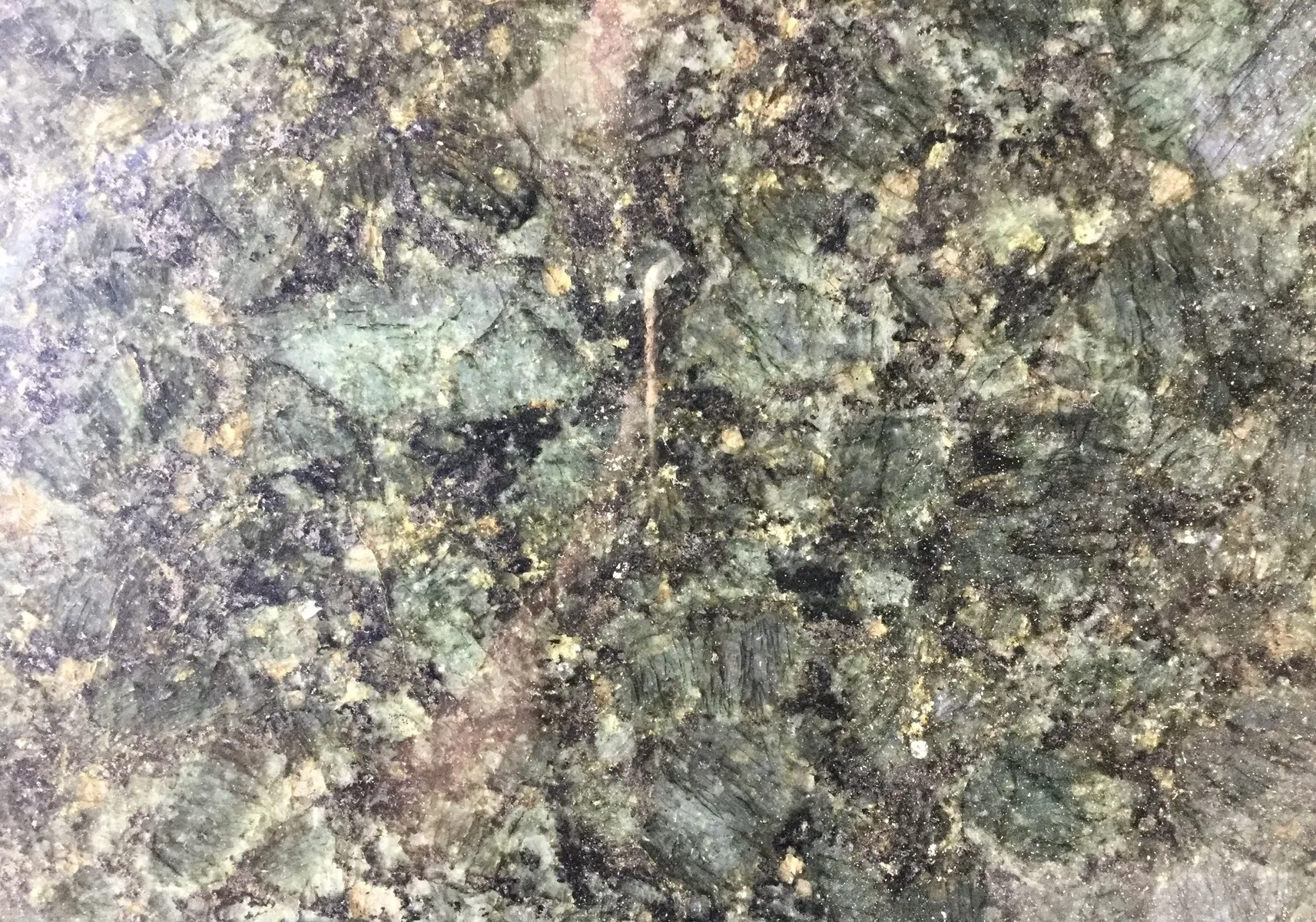 Closeup image of Peacock Green Green Granite countertop slab