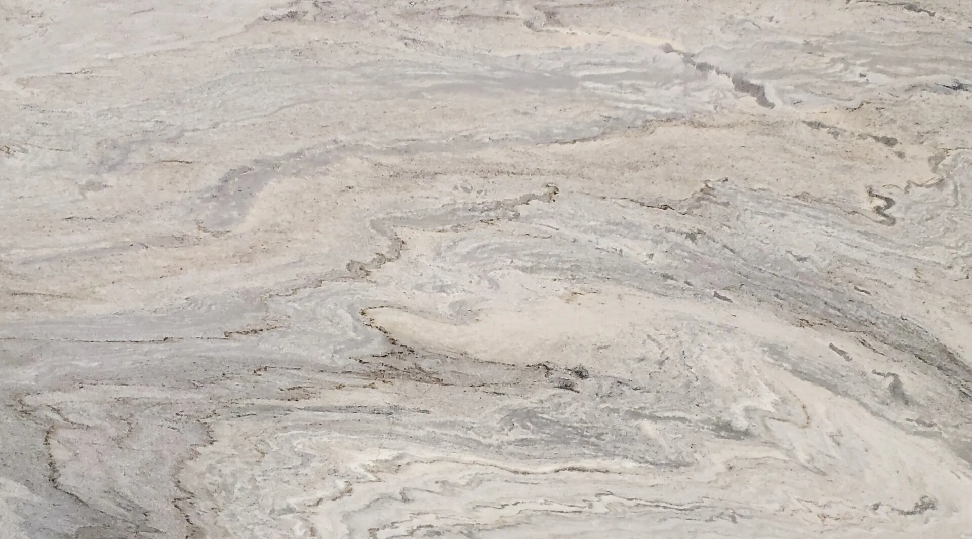Closeup image of River Blue Cream Marble countertop slab