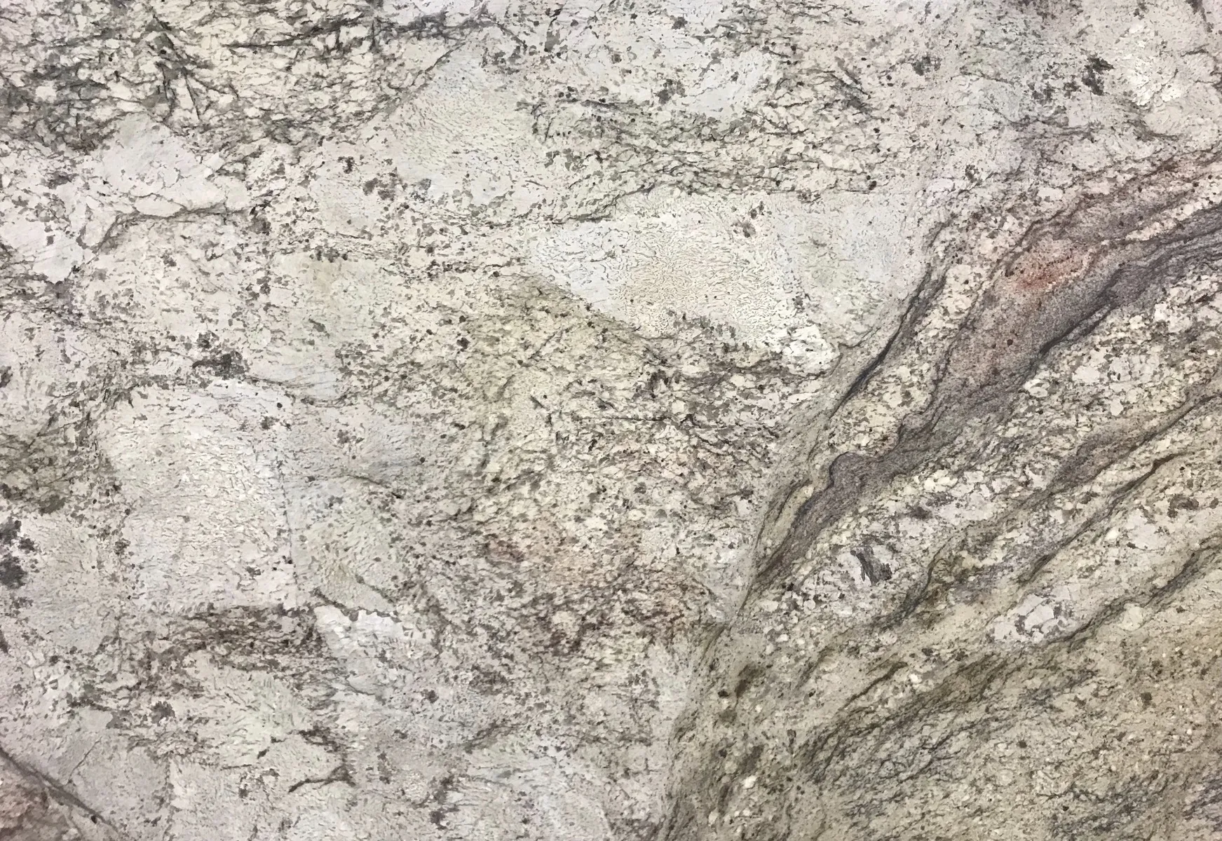 Closeup image of Siena Bordeaux Grey Granite countertop slab
