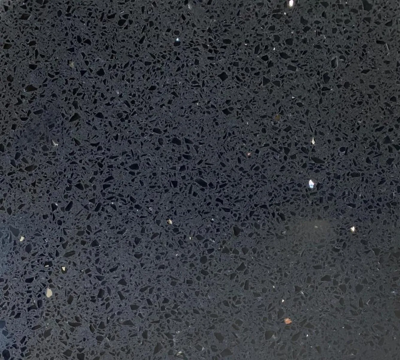 Closeup image of Opal Quartz Silver Night Black Quartz countertop slab