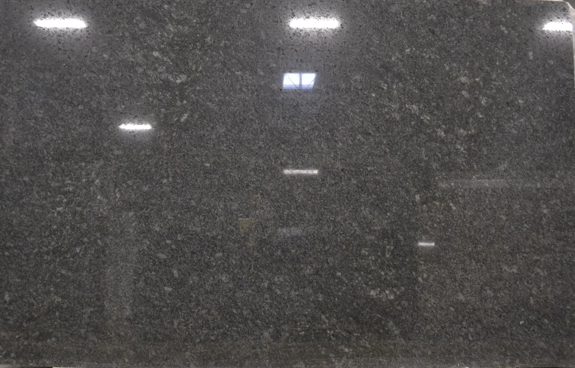 Closeup image of Silver Pearl (Steel Grey) Black Granite countertop slab