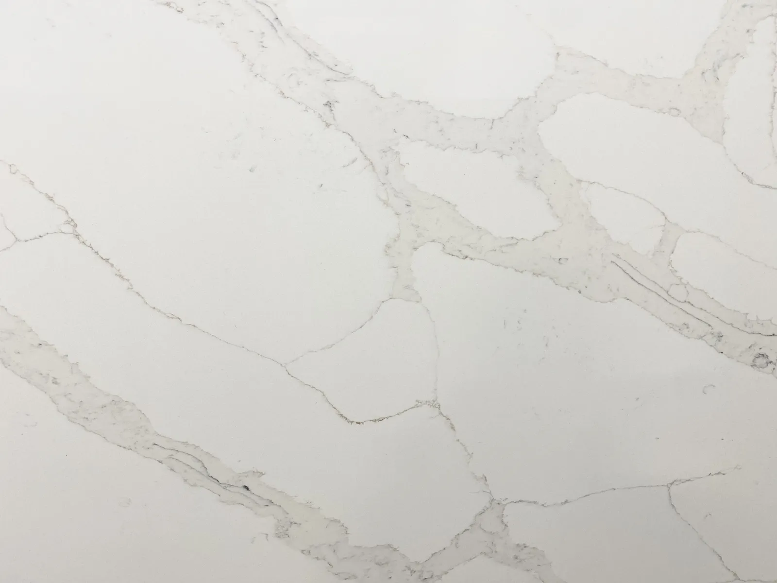 Closeup image of Opal Quartz Statuario Eternal Light White Quartz countertop slab