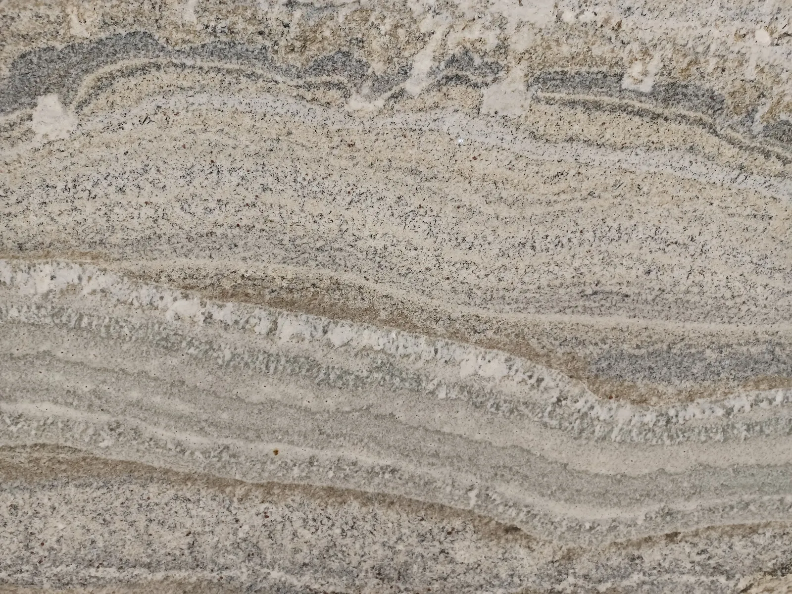 Closeup image of White Fusion Beige Granite countertop slab