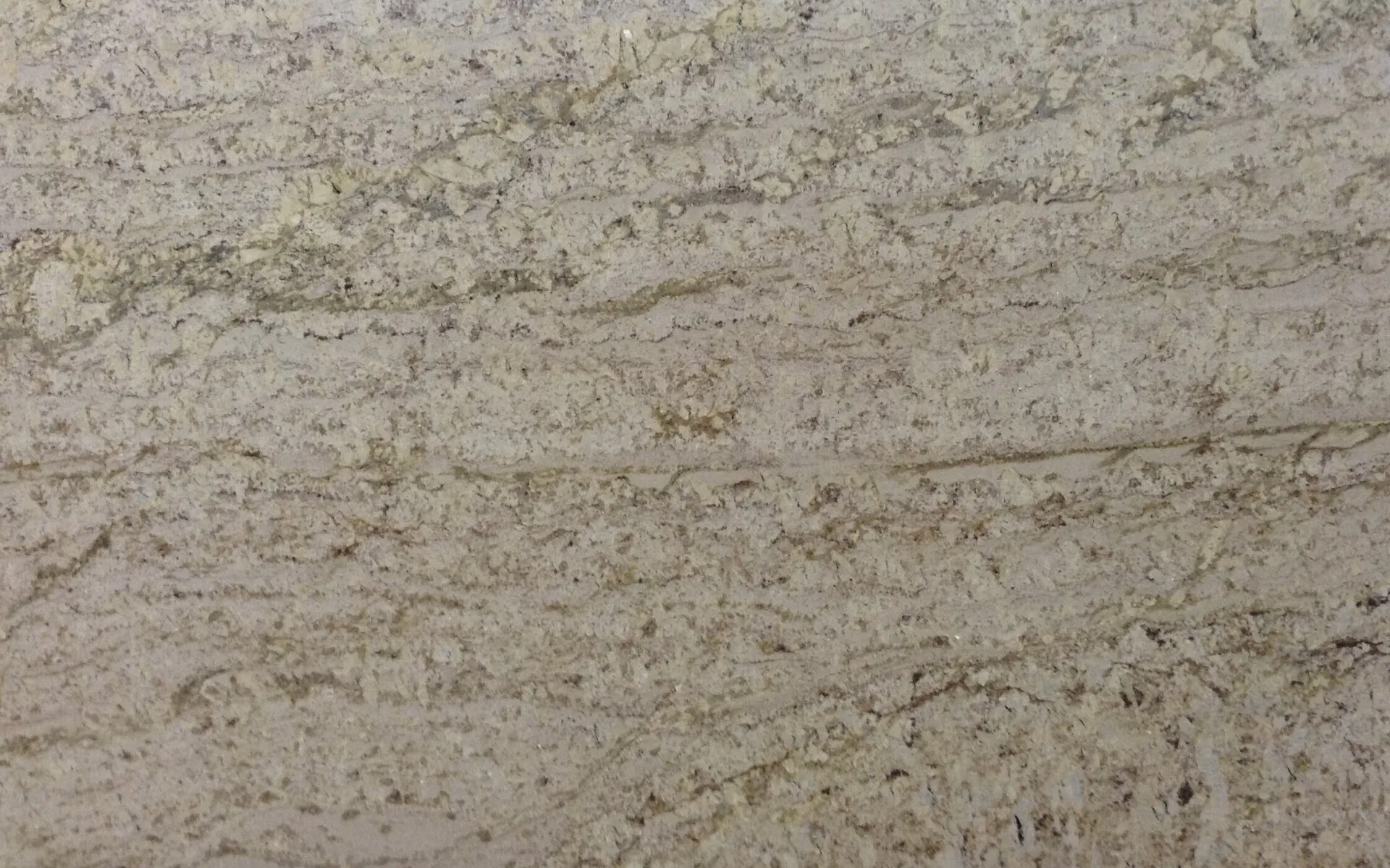 Closeup image of White Galaxy Beige Granite countertop slab