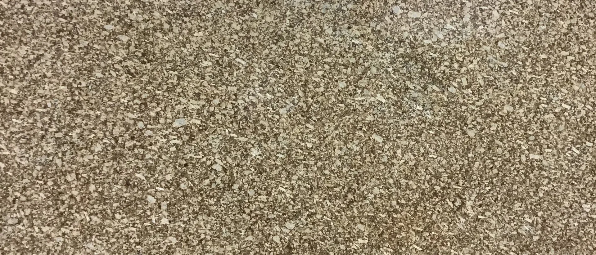Closeup image of Yellow Maracana Brown Granite countertop slab