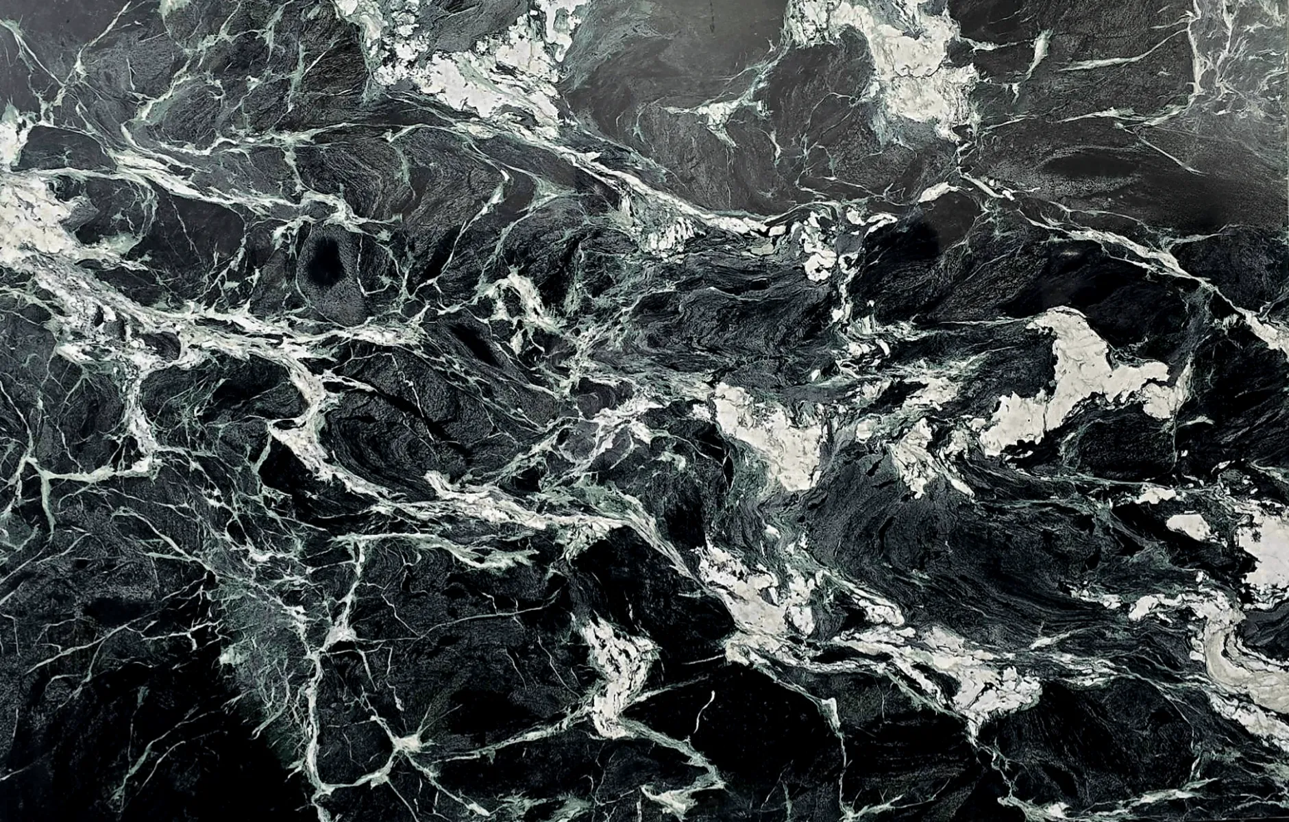 Closeup image of Verde Alpi Black Marble countertop slab