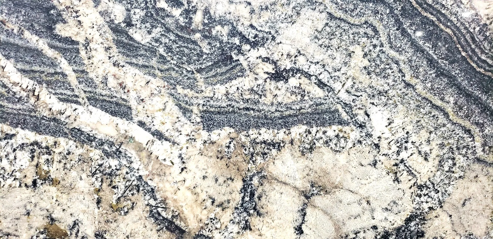 Closeup image of Blue Jeans Cream Granite countertop slab