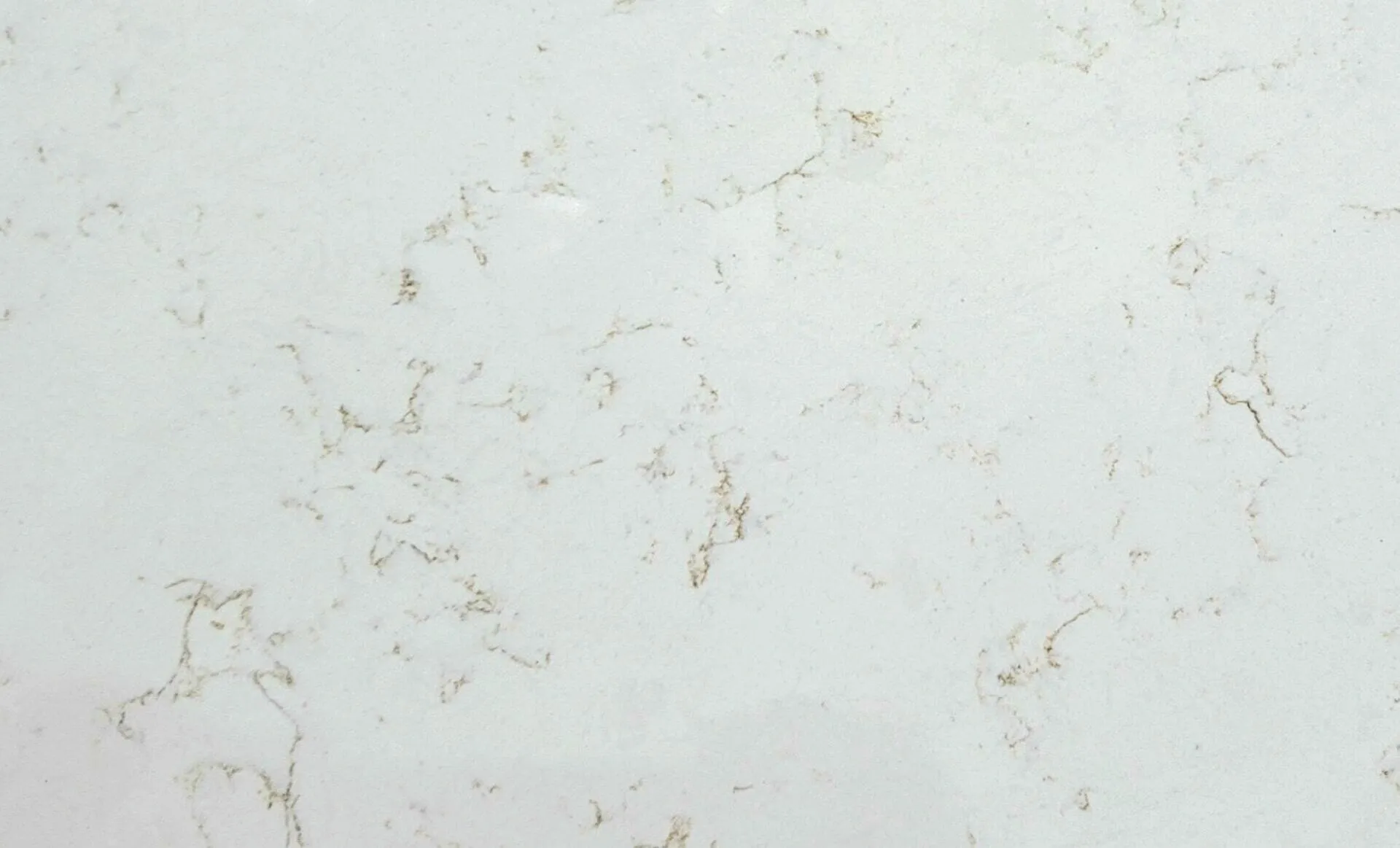Closeup image of CRS Quartz Carrara Mystique Super Jumbo Cream Quartz countertop slab