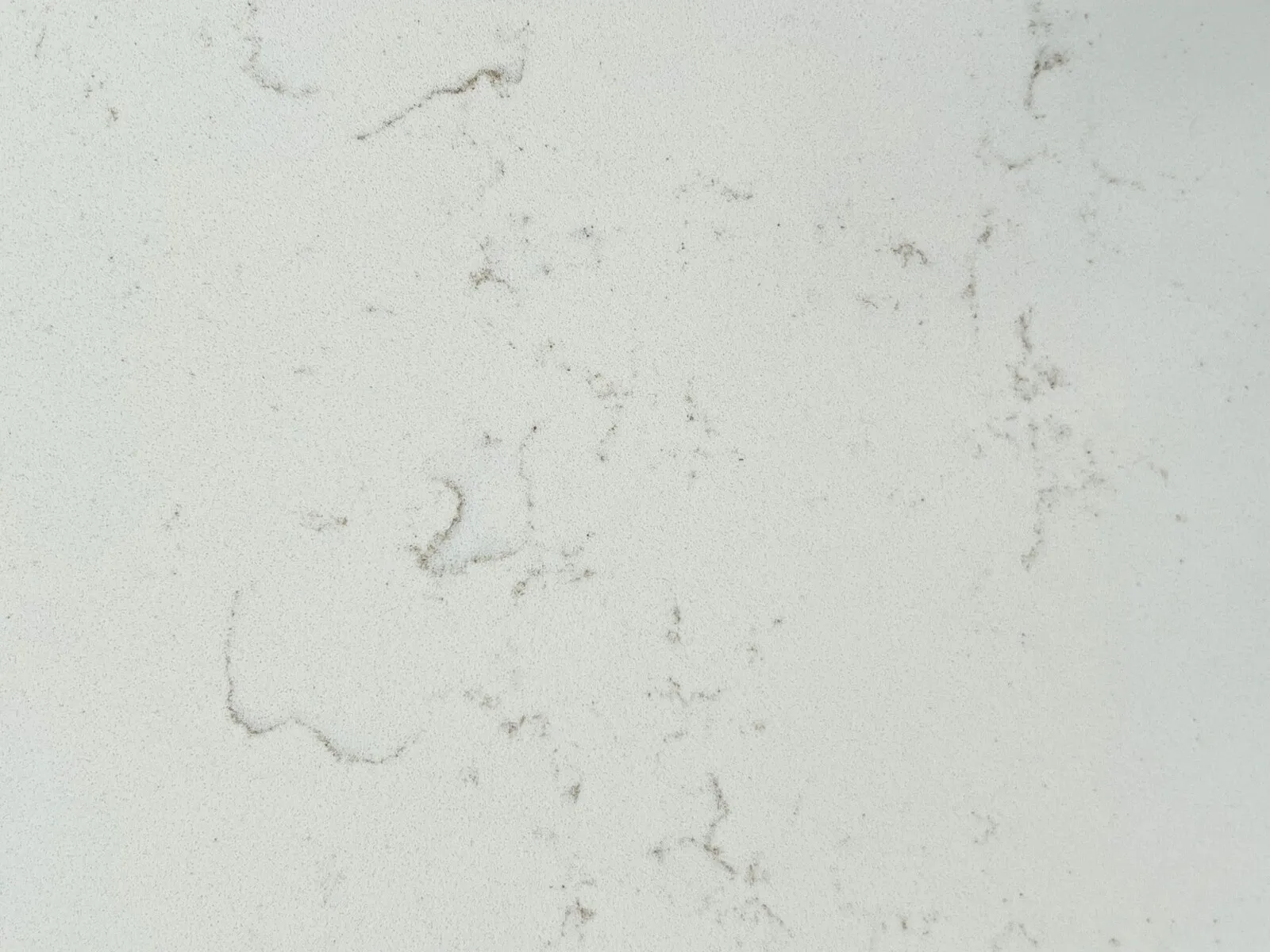 Closeup image of CRS Quartz Seasons Super Jumbo Cream Quartz countertop slab