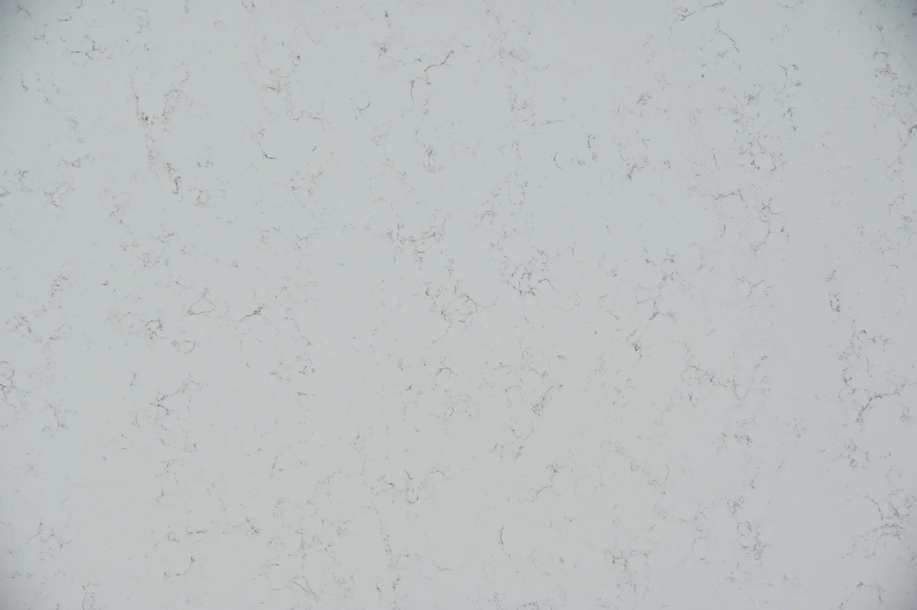 Closeup image of CRS Quartz Woldorf Super Jumbo White Quartz countertop slab