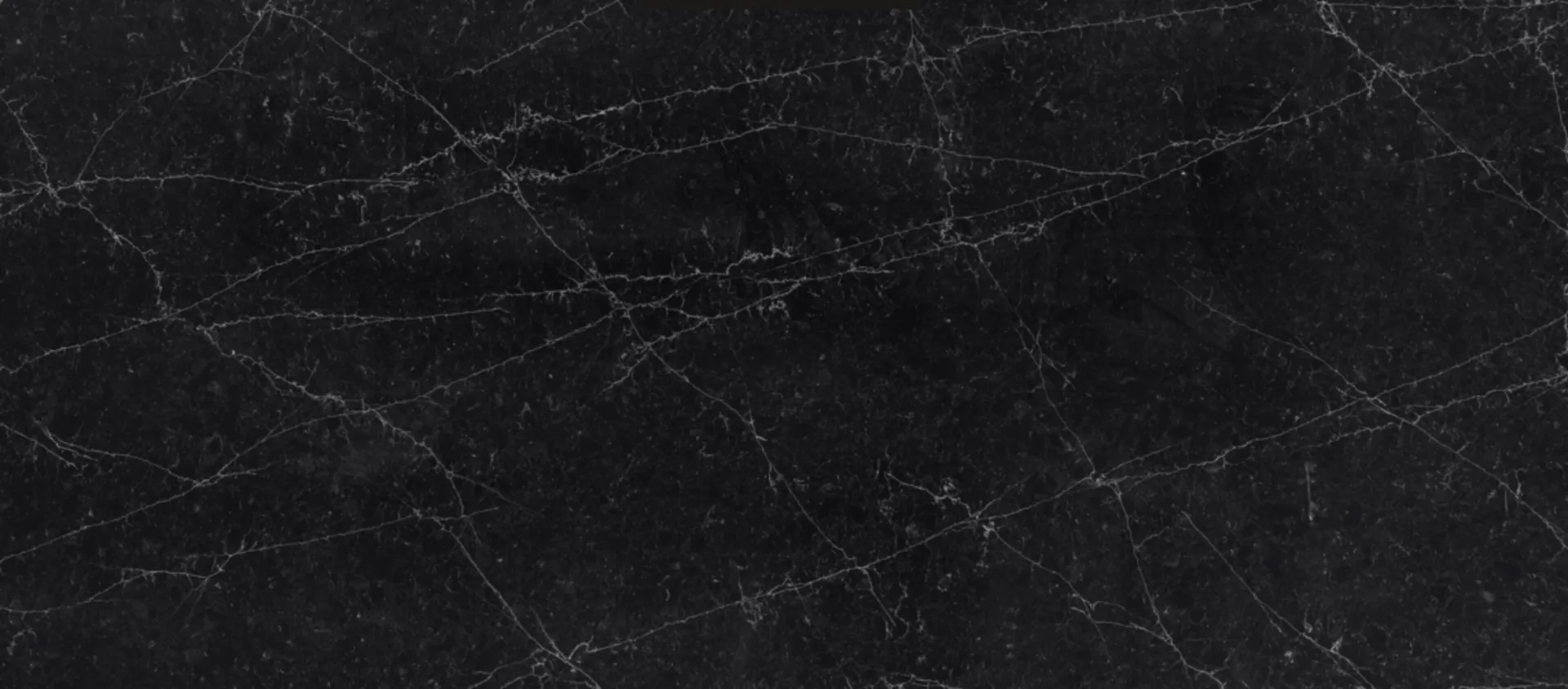 Closeup image of CRS Quartz Miranda Noir Brushed Super Jumbo Black Quartz countertop slab
