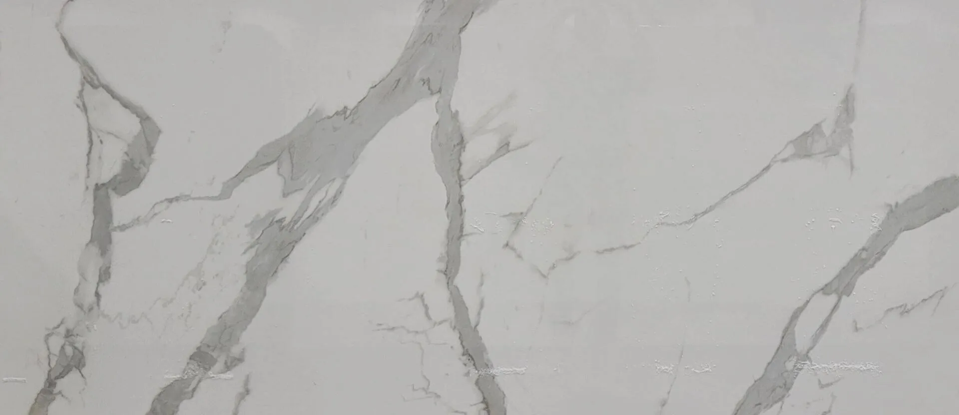 Closeup image of Infinity Calacatta Statuario Vein Tech White Porcelain countertop slab