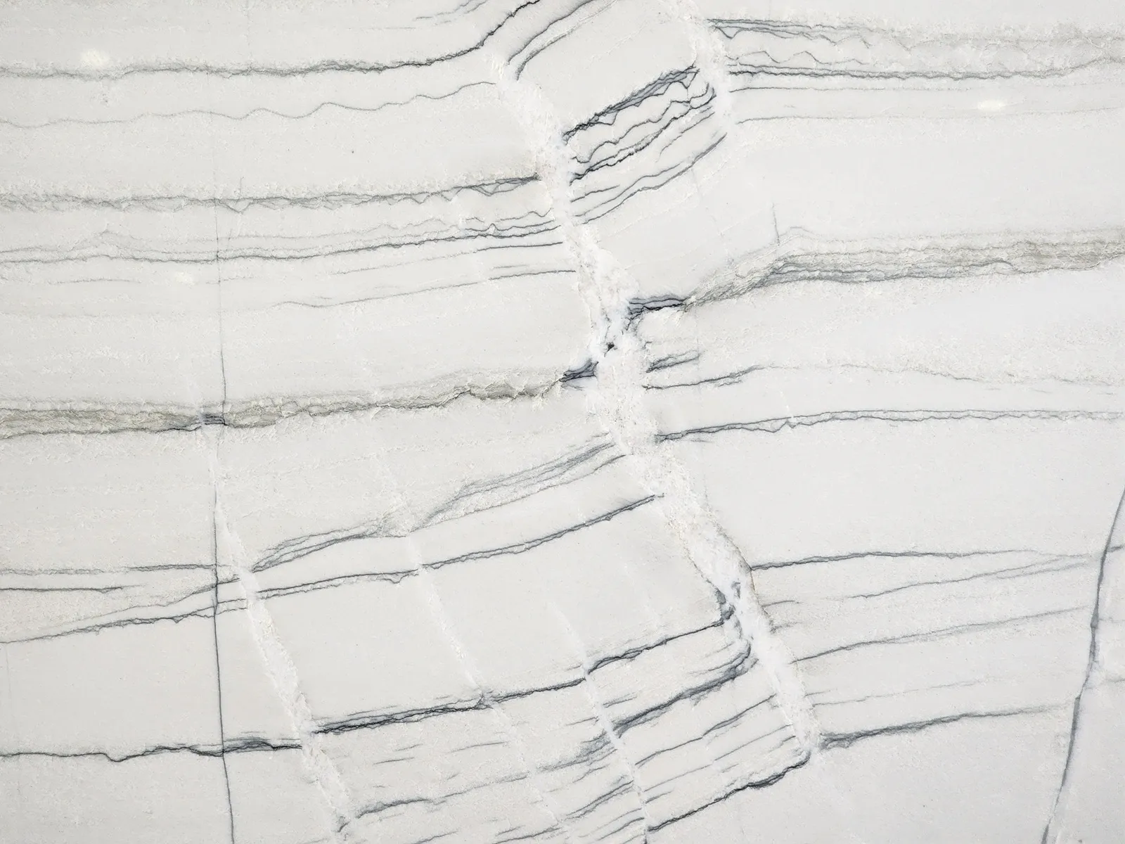 Closeup image of Luxica White Quartzite countertop slab