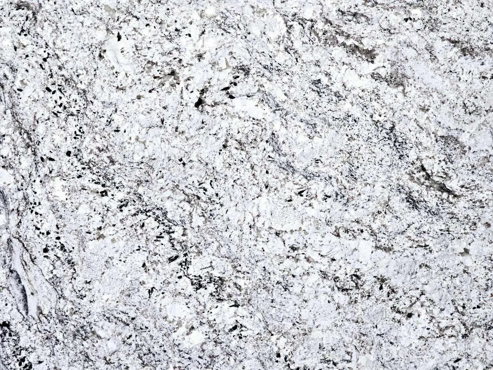 Closeup image of Nevaska White Granite countertop slab