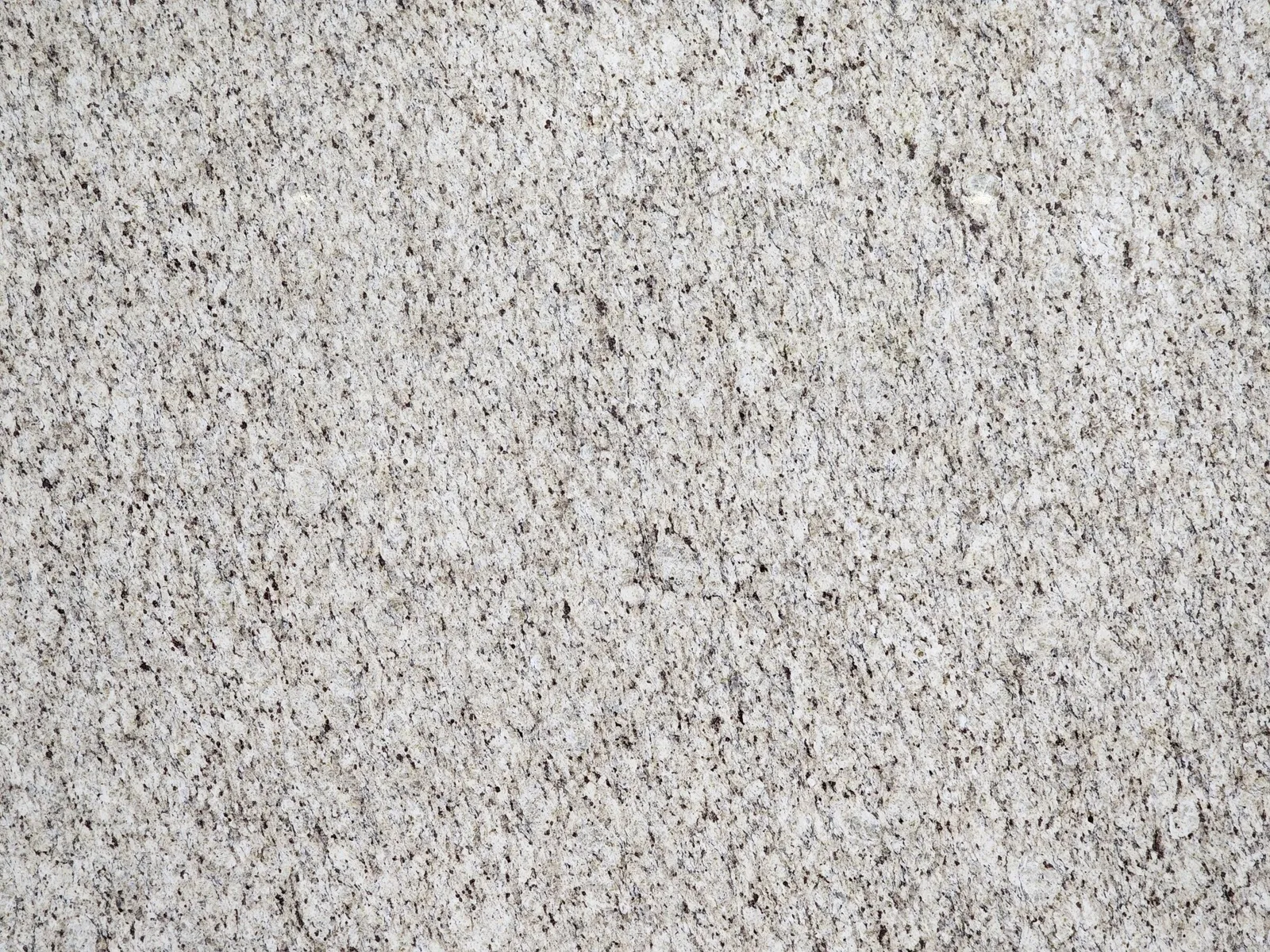 Closeup image of Ornamental Guidoni Cream Granite countertop slab