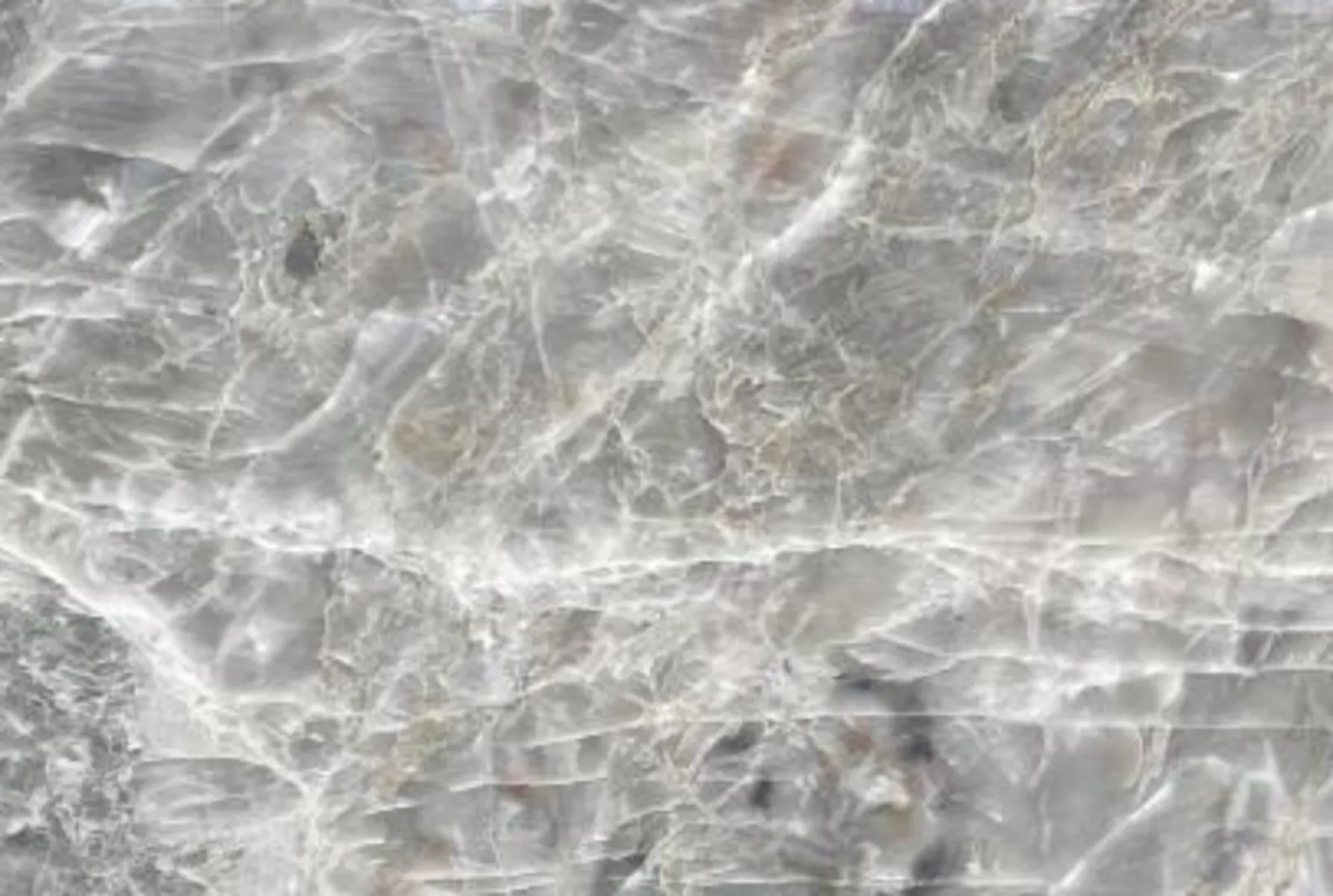 Closeup image of Smokey Crystal Grey Quartzite countertop slab